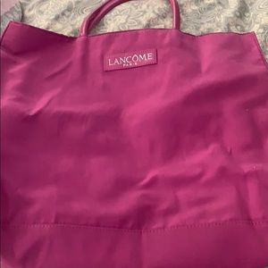Bright pink Lancome satchel
